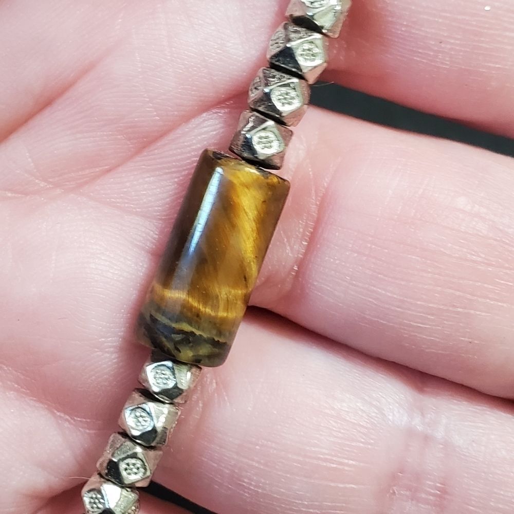 Adjustable corded bracelet with tigers eye stone